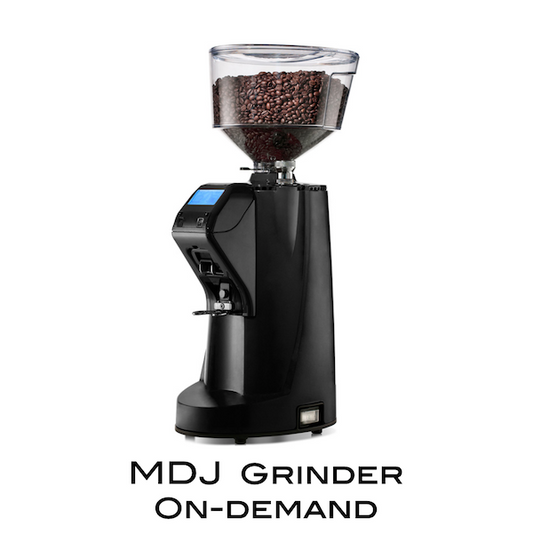 A black MDJ On-Demand Grinder by Nuova Simonelli with a large hopper of coffee beans and a digital display.